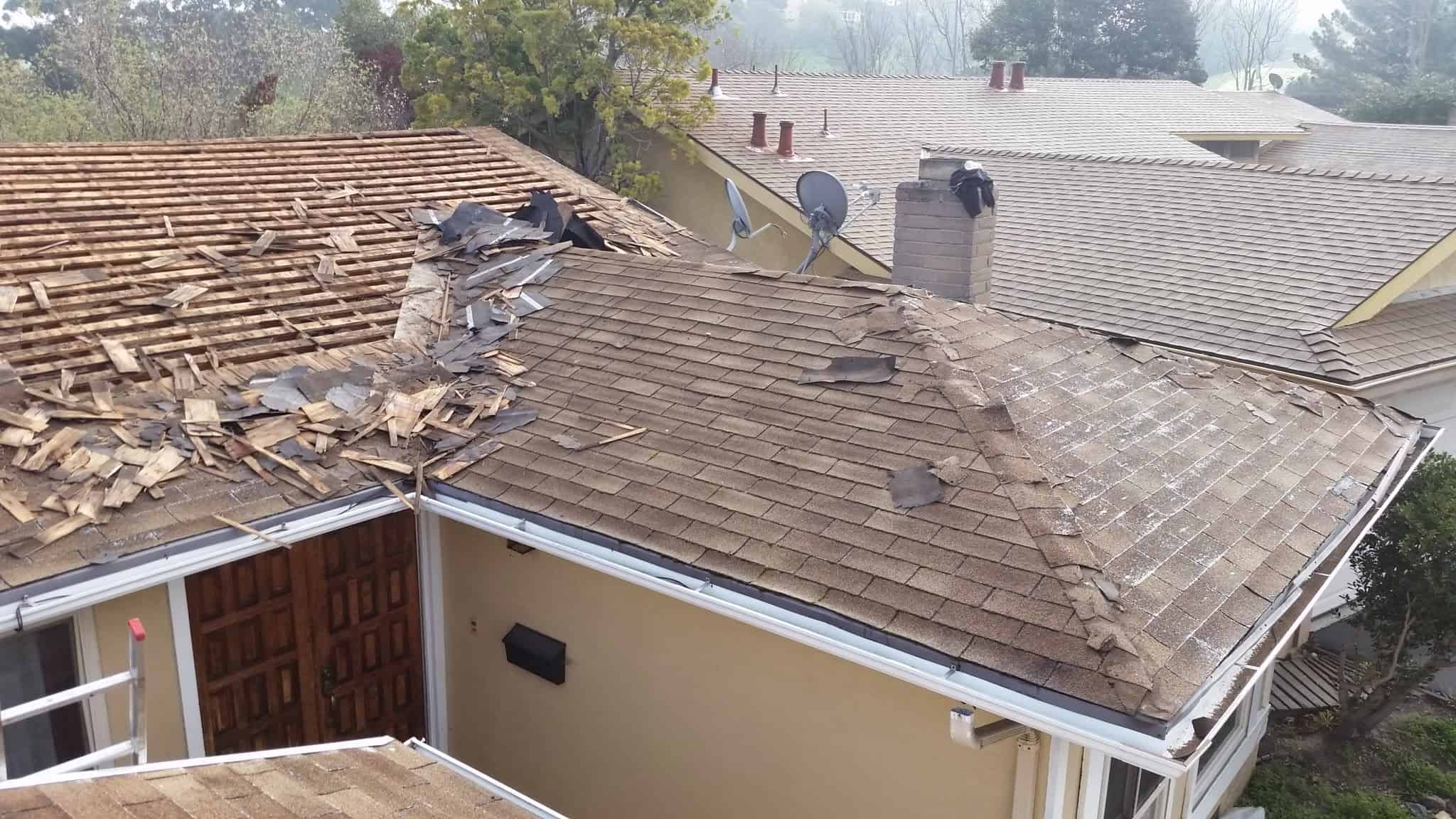 image of roofing contractor installing composition roof shingles